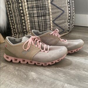 On Running Gray and Pink Athletic Shoes with Unique Sole Design